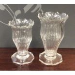 A pair of Georgian tapering fluted glass vases wit