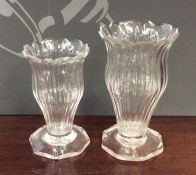 A pair of Georgian tapering fluted glass vases wit