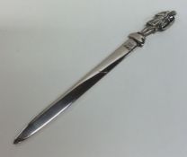 An unusual silver letter opener decorated with a k