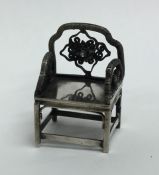 A Continental silver model of a chair with wire wo