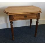 A Continental shaped top single drawer table on tu