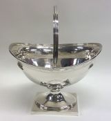 A good George III swing handled silver basket with