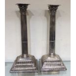 A pair of massive Georgian silver candlesticks on