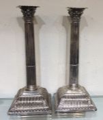 A pair of massive Georgian silver candlesticks on