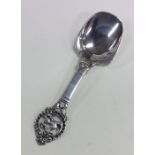 A Norwegian silver caddy spoon decorated with a dr