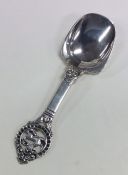 A Norwegian silver caddy spoon decorated with a dr