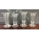 A group of four Georgian tapering glass goblets on
