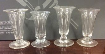 A group of four Georgian tapering glass goblets on