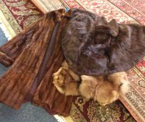 Three old fur coats. Est. £20 - £30.