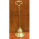 A tall brass doorstop of tapering form. Est. £20 -