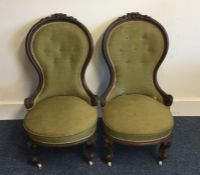 A pair of Victorian upholstered nursing chairs on