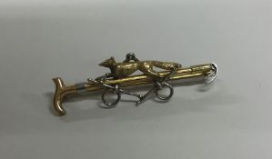 A good high carat gold brooch in the form of a rid