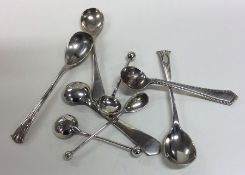 A bag containing numerous silver cruet spoons. App