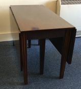 A large Georgian mahogany two lap table with reede