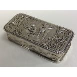 A large rectangular silver chased box profusely de