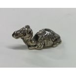 A 20th Century figure of a silver seated camel wit