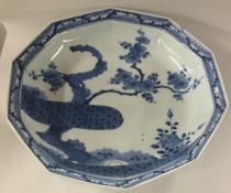 A Chinese blue and white bowl decorated with cherr