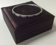 A good quality diamond bangle with concealed clasp