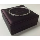 A good quality diamond bangle with concealed clasp
