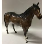 A Beswick figure of a horse in standing position.