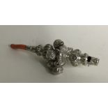 A good Victorian silver rattle together with teeth
