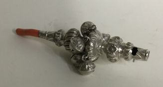 A good Victorian silver rattle together with teeth