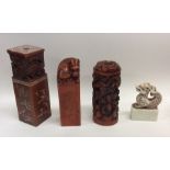 A group of four large Chinese ingots. Est. £30 - £