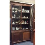 A Georgian mahogany bookcase with bevelled glass.