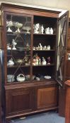 A Georgian mahogany bookcase with bevelled glass.