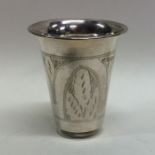 An Edwardian silver vodka tot with engraved decora