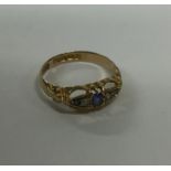 A sapphire and diamond five stone ring. Approx. 2.