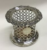 A silver plated wine coaster with embossed top and