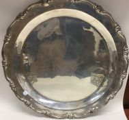 A large Continental silver salver with shaped rim.