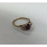 A ruby and diamond thirteen stone cluster ring in