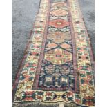 An old Oriental rug decorated in bright colours. E