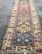 An old Oriental rug decorated in bright colours. E