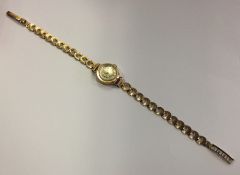 A 9 carat lady's wristwatch. Approx. 12 grams. Est