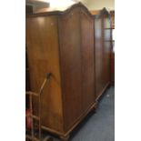 A pair of burr walnut wardrobes together with matc