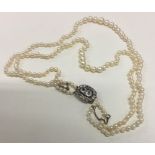 A good Georgian double string of pearl beads with