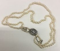 A good Georgian double string of pearl beads with