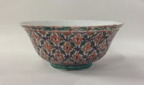 An unusual Chinese rice bowl decorated in bright c