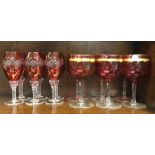 Two attractive sets of cranberry glasses. Est. £20