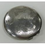 A heavy circular Chinese silver compact decorated