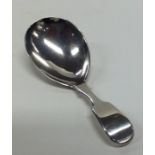 A Victorian silver fiddle pattern caddy spoon. Lon