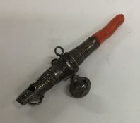 A Georgian silver and coral rattle. Approx. 15 gra