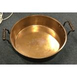 A heavy brass mounted two handled preserve pan. Es
