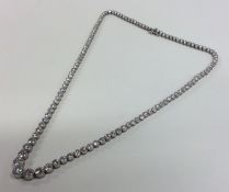 A fine platinum and diamond tapering necklace with