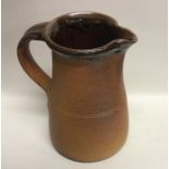 MUCHELNEY: A John Leach tapering stoneware jug wit