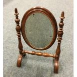 A small doll's house dressing mirror on turned sup
