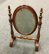 A small doll's house dressing mirror on turned sup